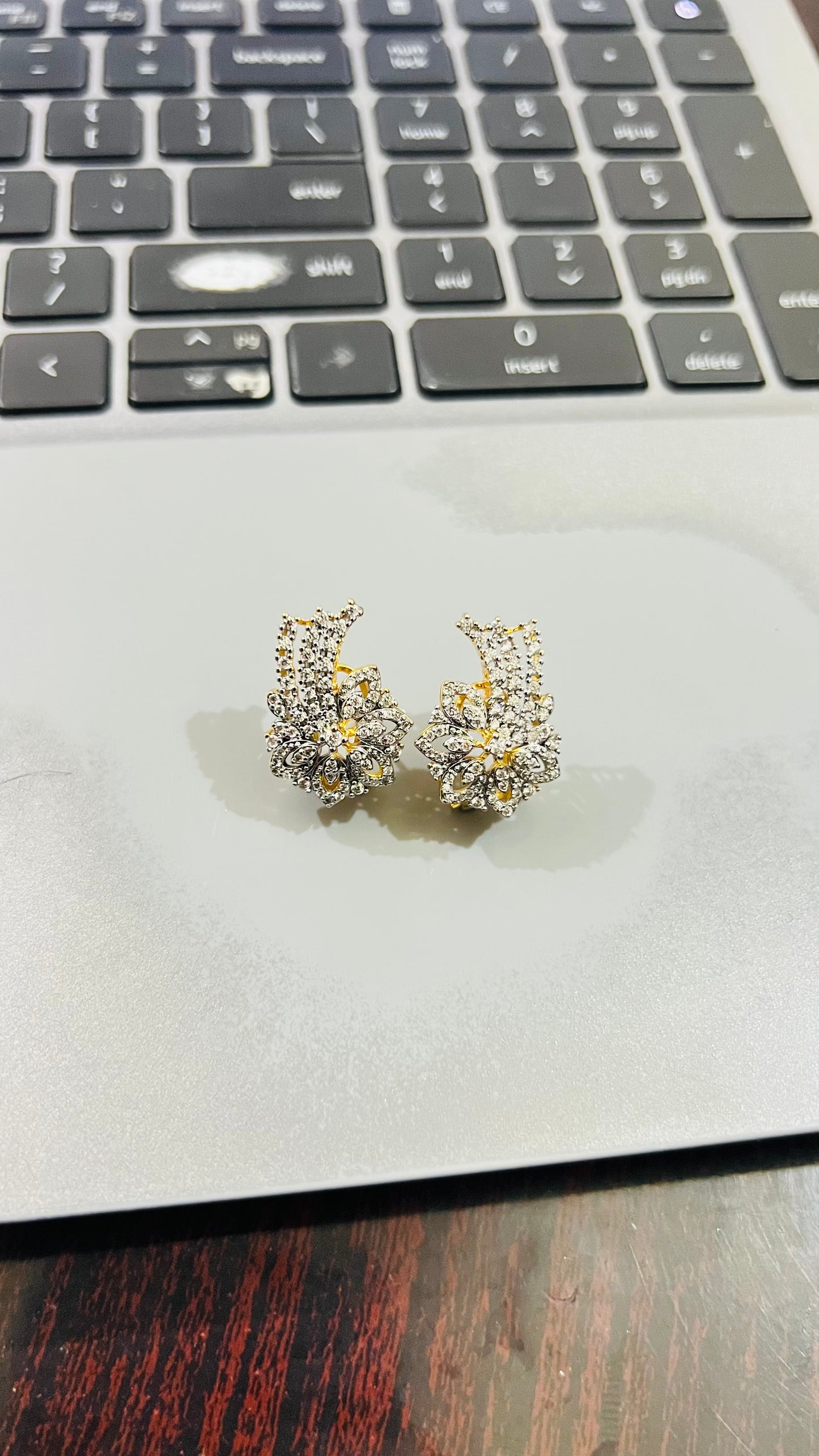 Nerissa 24K gold plated stud earrings with a delicate floral zircon setting