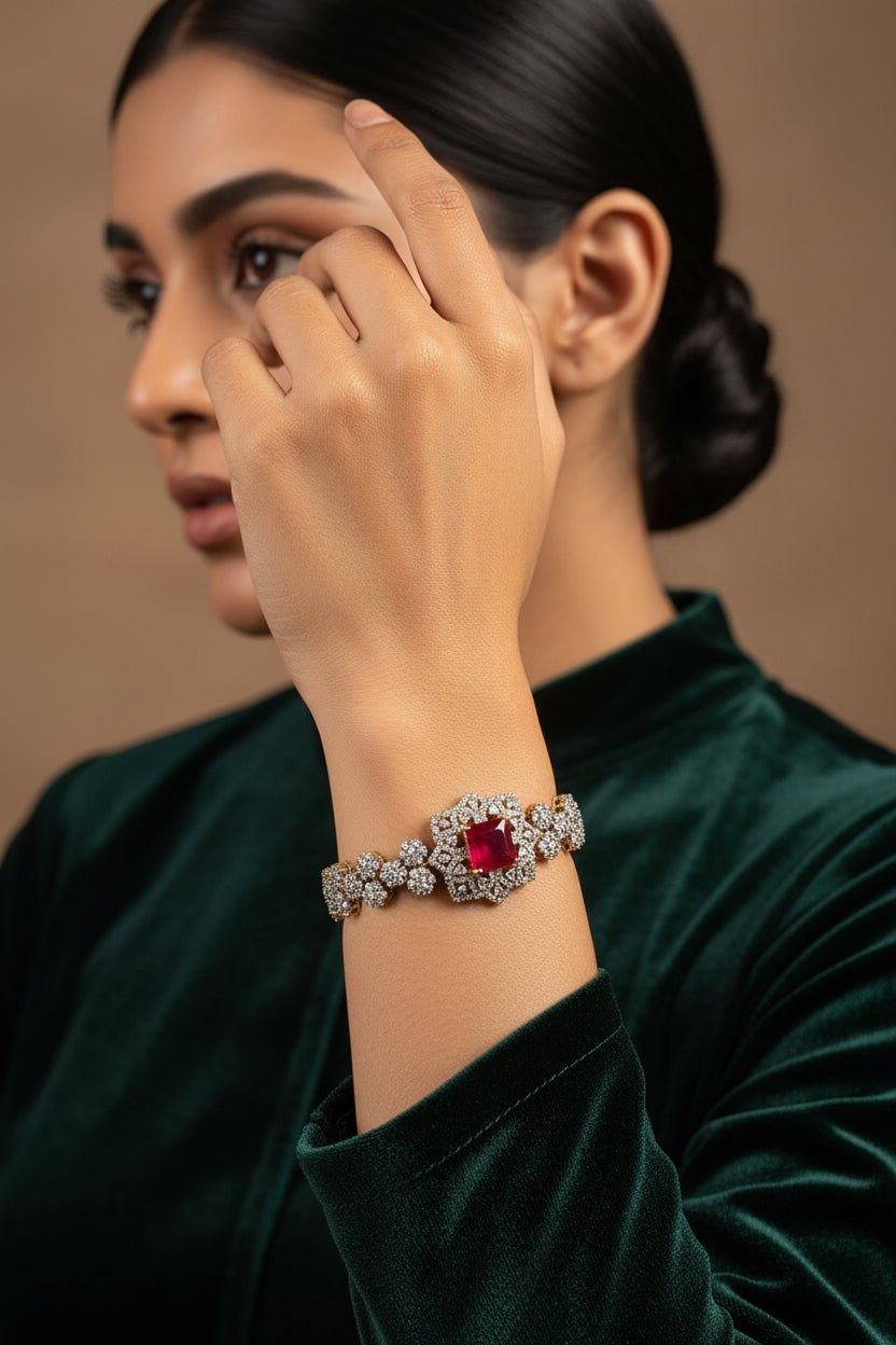 24K gold plated bracelet with a ruby-red centre stone in an American zircon floral halo and matching zircon links