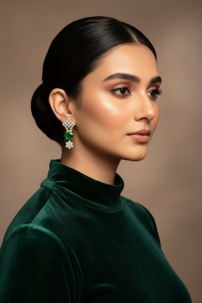 24K gold plated drop earrings with green oval centre stones held in American zircon floral clusters