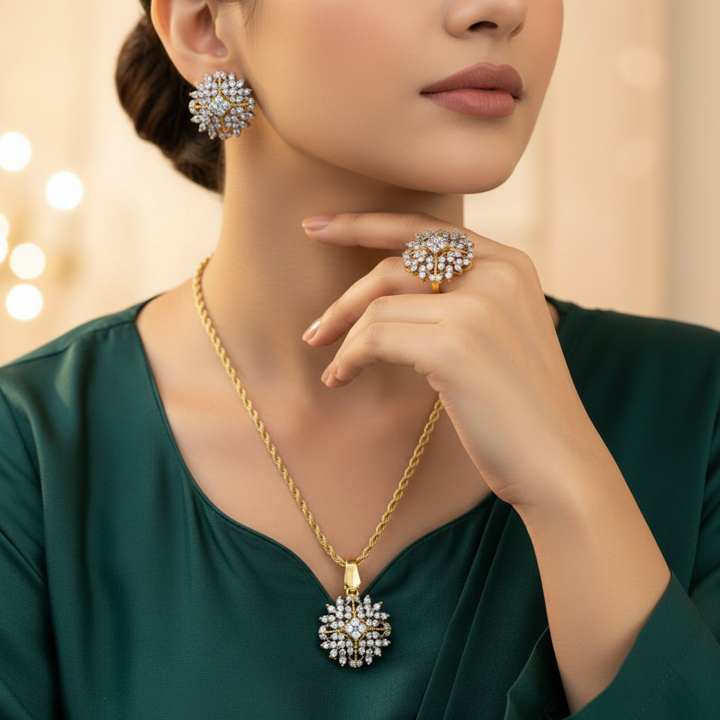 Woman wearing gold necklace, ring, and earrings with a blurred background