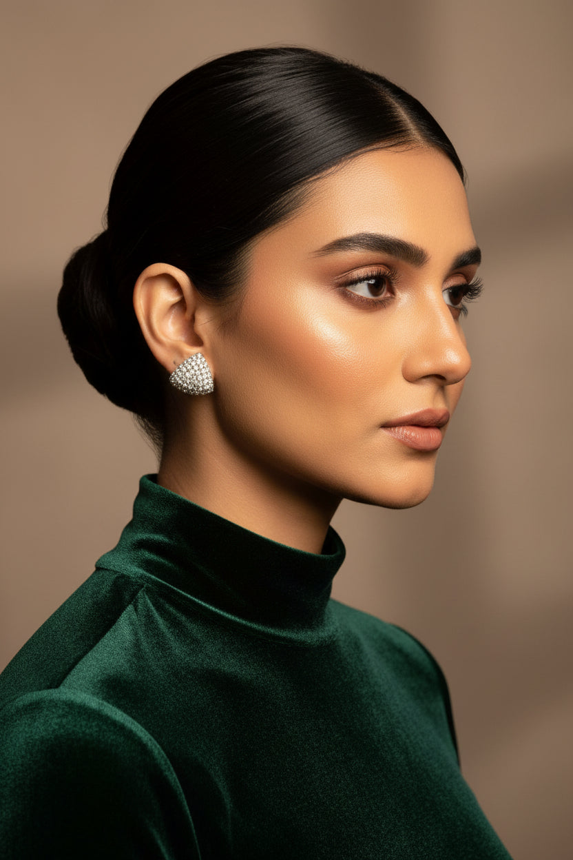 Cushion-shaped 24K gold plated studs paved edge to edge with round American zircon stones, worn on the ear