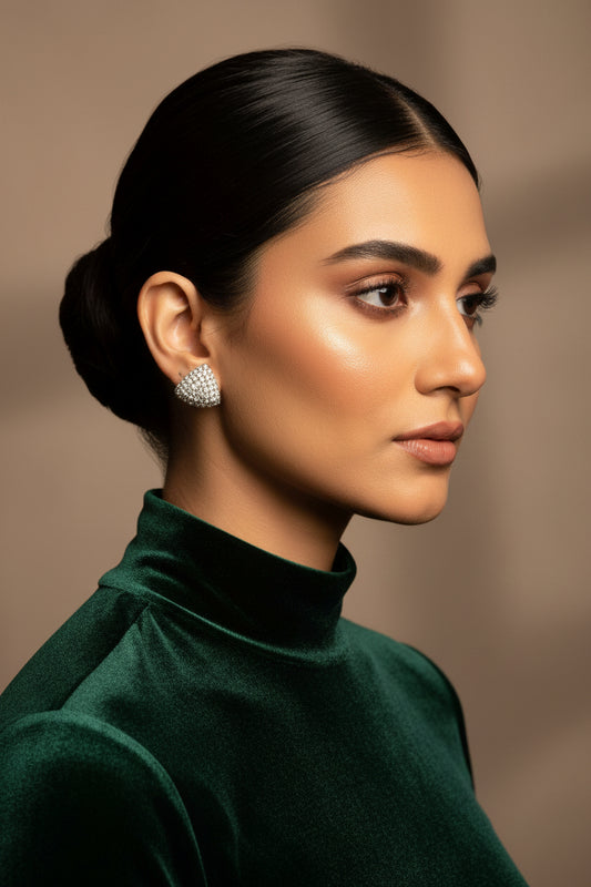 Cushion-shaped 24K gold plated studs paved edge to edge with round American zircon stones, worn on the ear