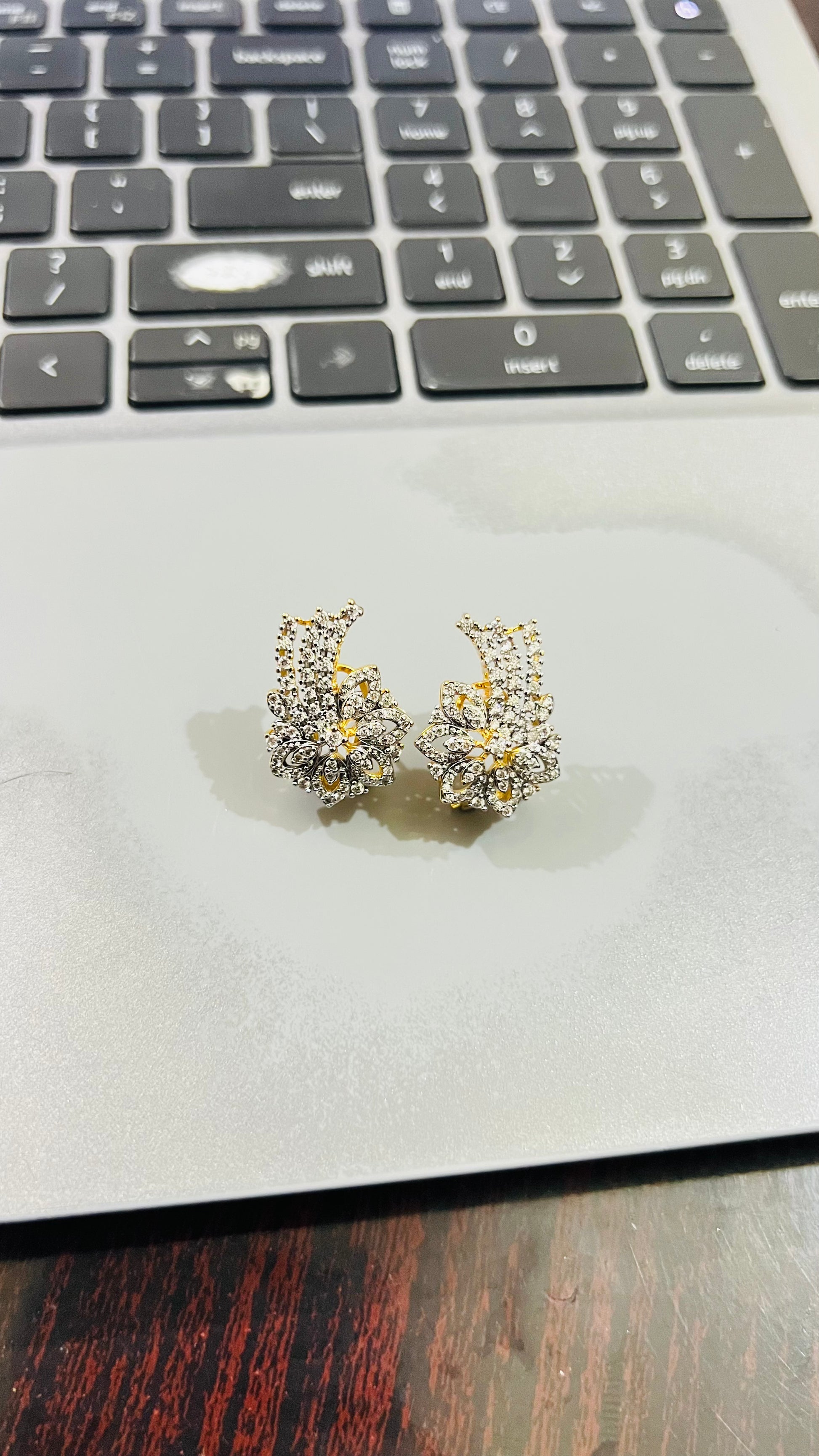 Nerissa 24K gold plated stud earrings with a delicate floral zircon setting