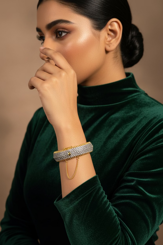 Zahra 24K gold plated bangle with diamond cut detailing and clear zircon stones