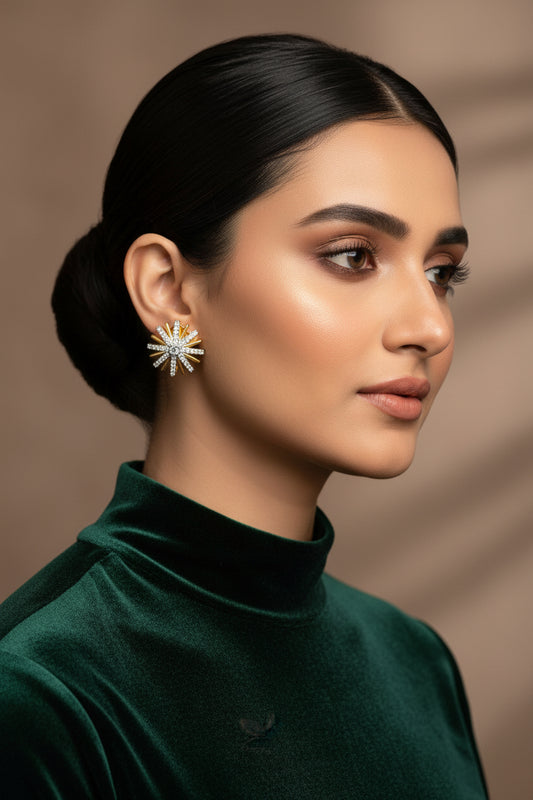 British Spin 24K gold plated studs with a spiral diamond-cut face and American zircon centre