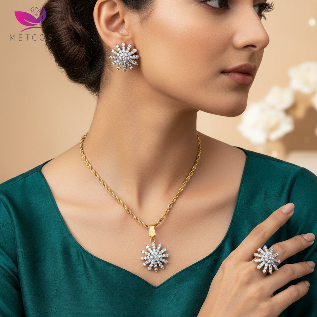 A set of gold-plated zirconia jewelry including a pendant and a ring, displayed against a neutral background.