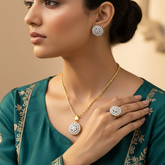 A gold-plated locket set with diamond-cut details, including an elegant locket and matching earrings, presented on a beige background.