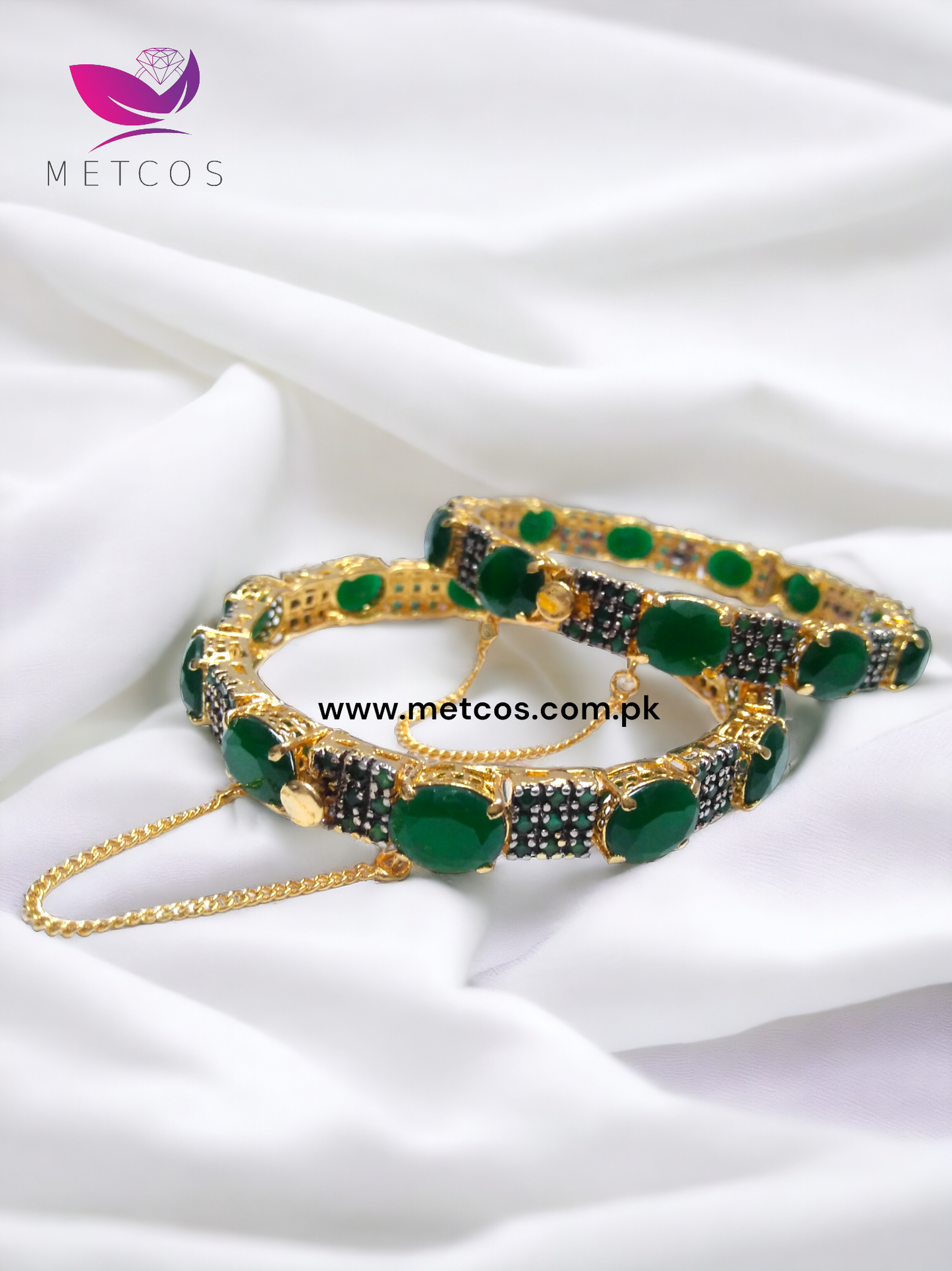 Emerald Lovers 24K gold plated jewelry set with green stones and a diamond-cut surround