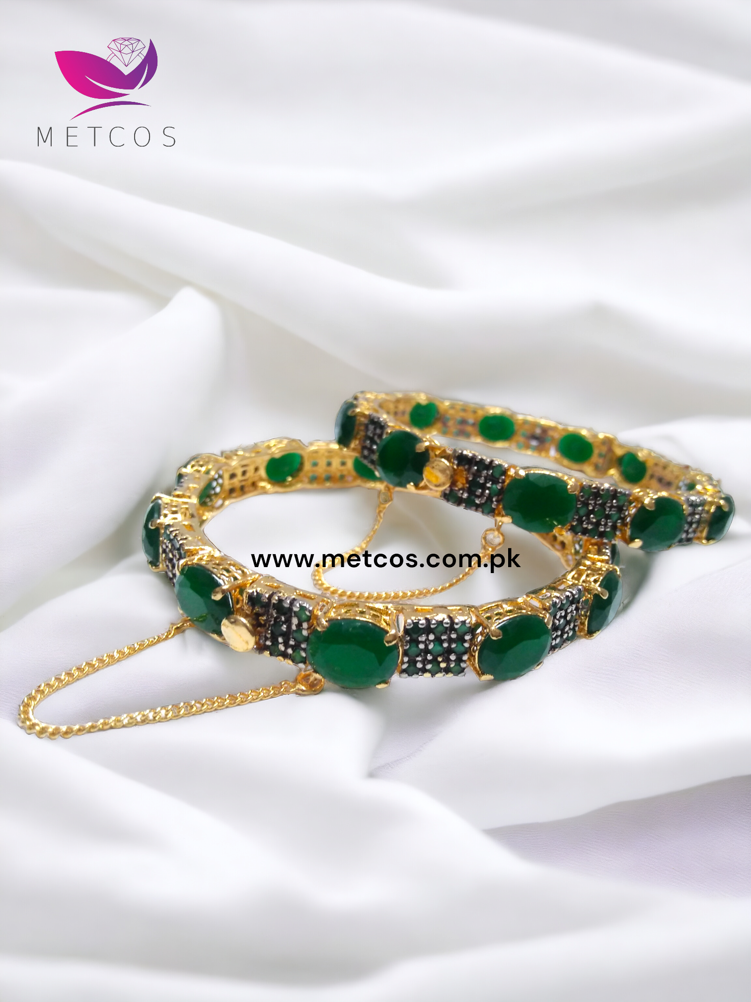 Emerald Lovers 24K gold plated jewelry set with green stones and a diamond-cut surround